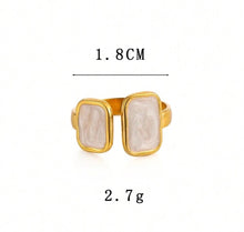 Load image into Gallery viewer, Close-up view of the Cloudstone Adjustable Ring featuring a smooth marble-inspired pearl centerpiece with a gold adjustable band