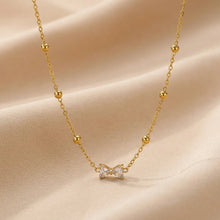 Load image into Gallery viewer, Crystal bow necklace Bloome.pk
