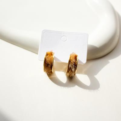 Stylish hoop earrings featuring cozy brown faux fur texture and gold edges
