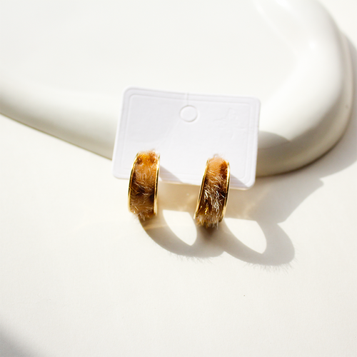 Stylish hoop earrings featuring cozy brown faux fur texture and gold edges