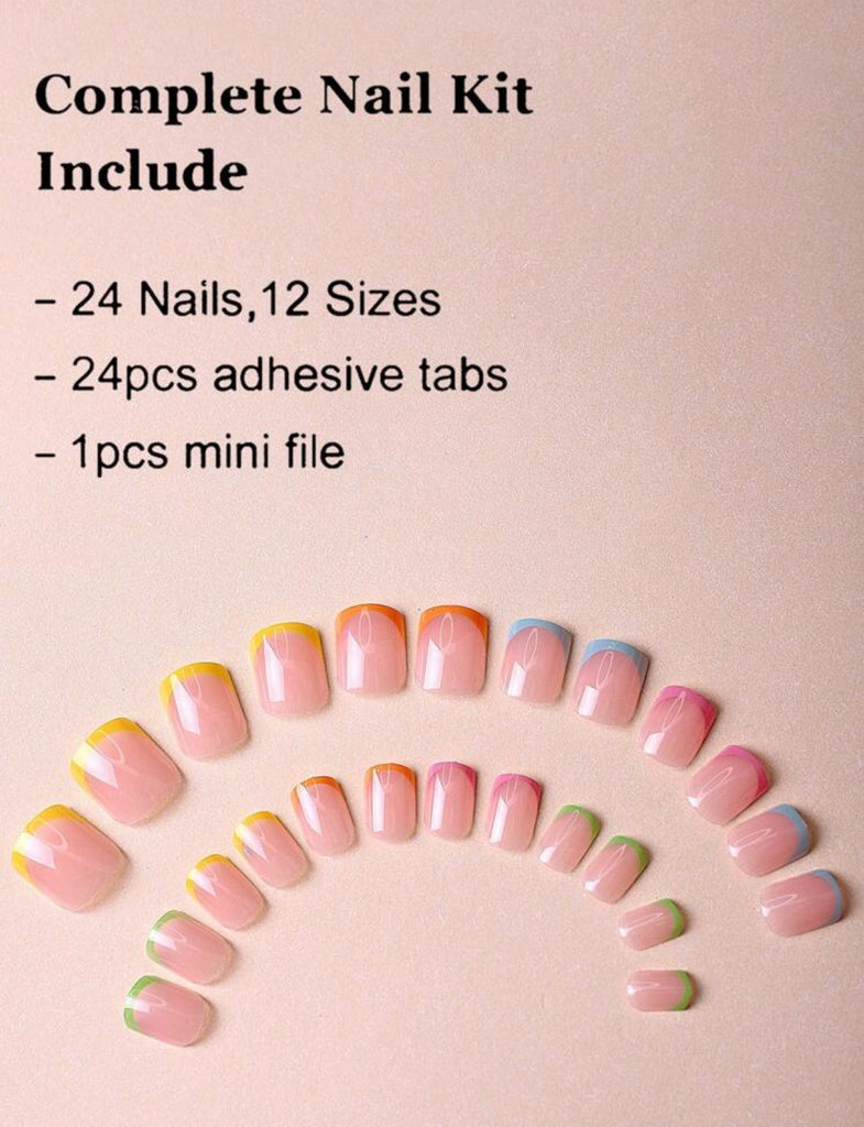 Hand with pastel French tip fake nails in green, pink, orange, blue, and yellow shades – stylish CandyTips press-on nails