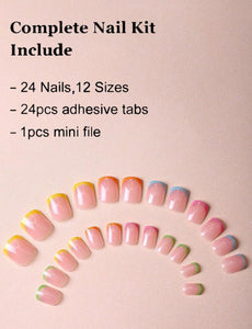 Hand with pastel French tip fake nails in green, pink, orange, blue, and yellow shades – stylish CandyTips press-on nails