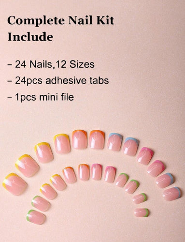 Hand with pastel French tip fake nails in green, pink, orange, blue, and yellow shades – stylish CandyTips press-on nails