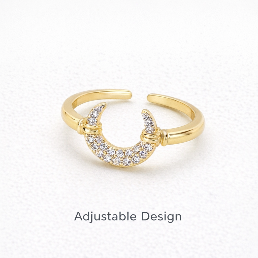 Gold ring with crescent moon design on a white background