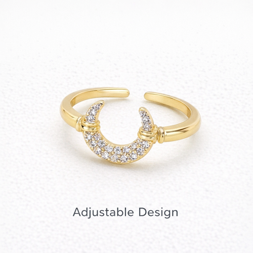 Gold ring with crescent moon design on a white background