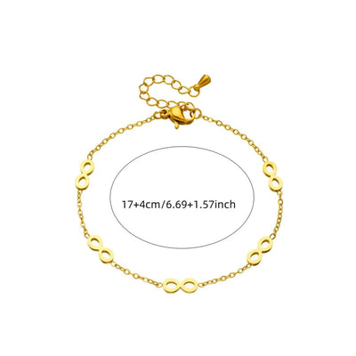 Gold bracelet with infinity symbol on a white background