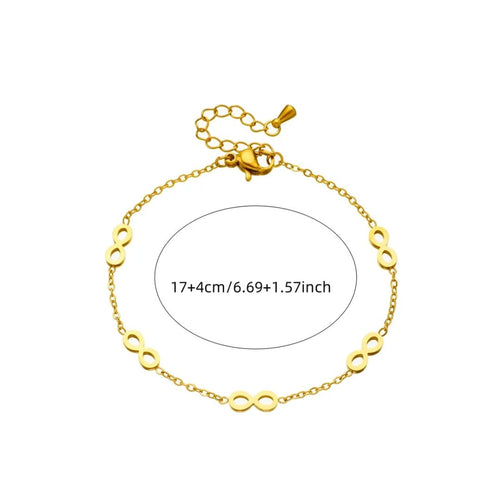 Gold bracelet with infinity symbol on a white background