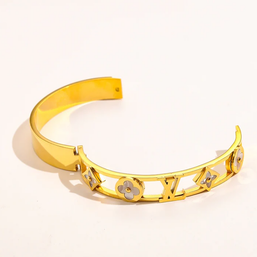 Gold branded bangles in elegant designs, offering premium quality at an affordable price