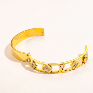 Gold branded bangles in elegant designs, offering premium quality at an affordable price