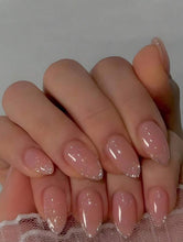 Load image into Gallery viewer, Close-up of a hand with pink glittery nails on a neutral background