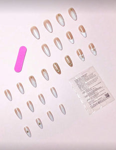 Set of false nails with a pink tool and packaging on a light background