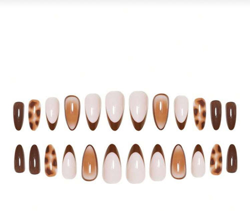 Set of nail art designs with brown, white, and tortoiseshell patterns on a white background