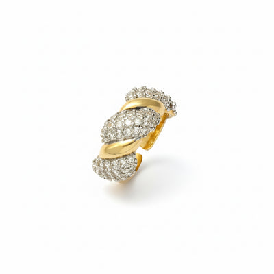 Gold and silver spiral earring on a white background