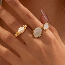 Load image into Gallery viewer, Ivory Swirl Ring – Elegant gold-plated stainless steel ring with a smooth ivory enamel finish. Anti-tarnish, durable, and perfect for everyday wear. Shop online in Pakistan at the best price