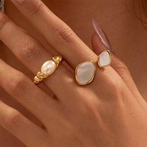 Ivory Swirl Ring – Elegant gold-plated stainless steel ring with a smooth ivory enamel finish. Anti-tarnish, durable, and perfect for everyday wear. Shop online in Pakistan at the best price