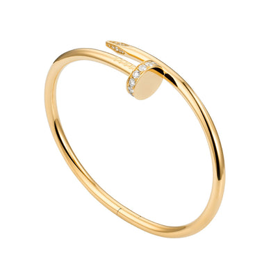 Gold bracelet with a round clasp on a white background